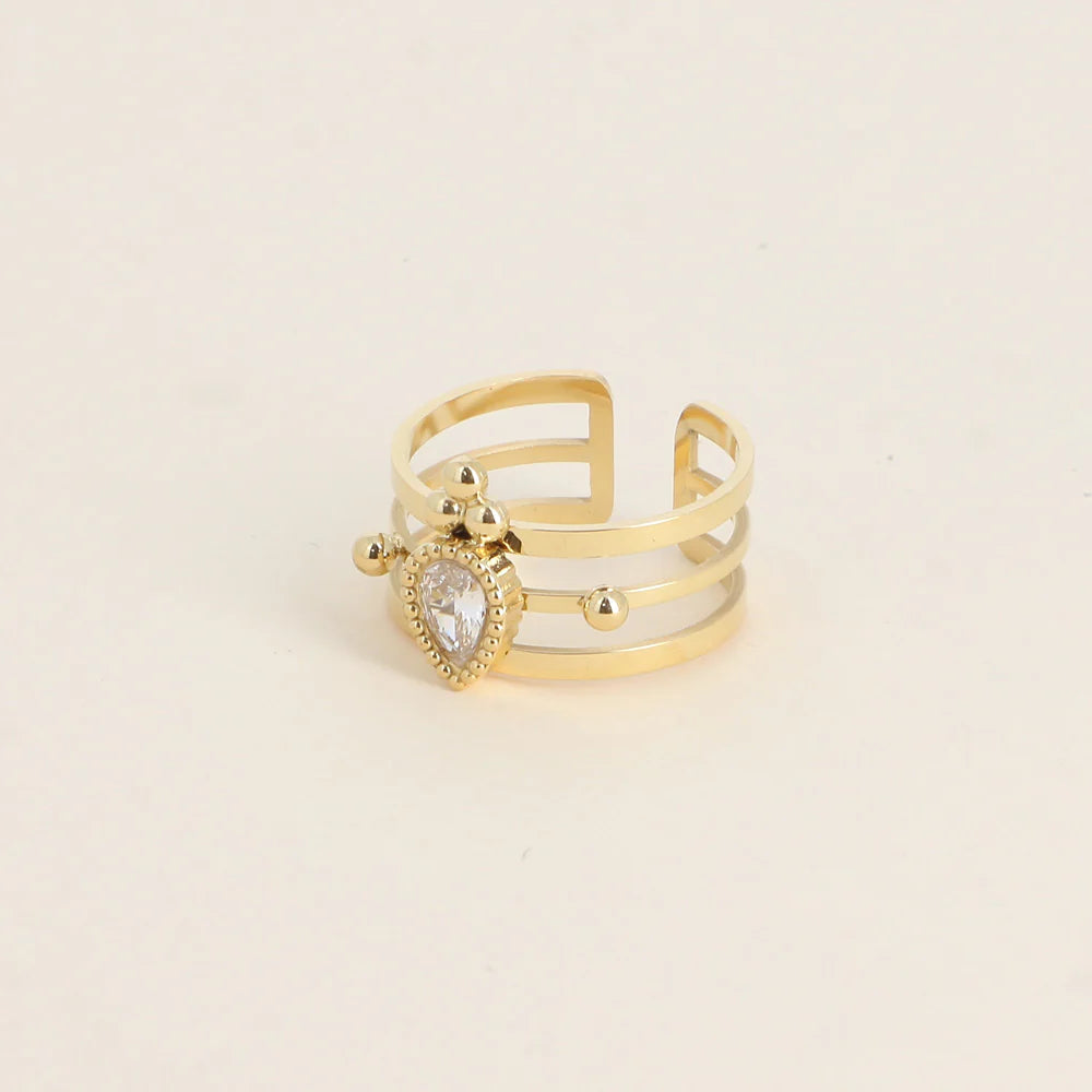 Bague Milan – Triple Anneau Doré & Cristal Goutte
